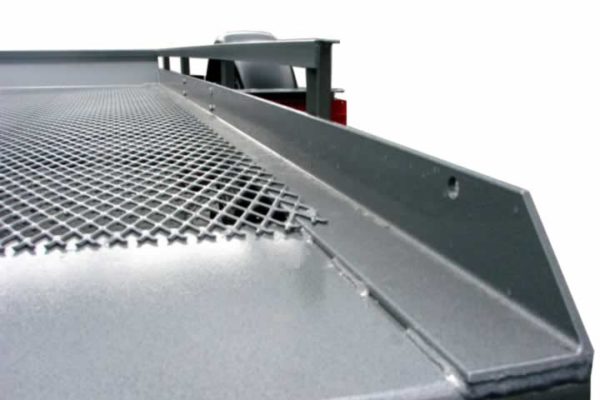 A close up of the grill on a metal table