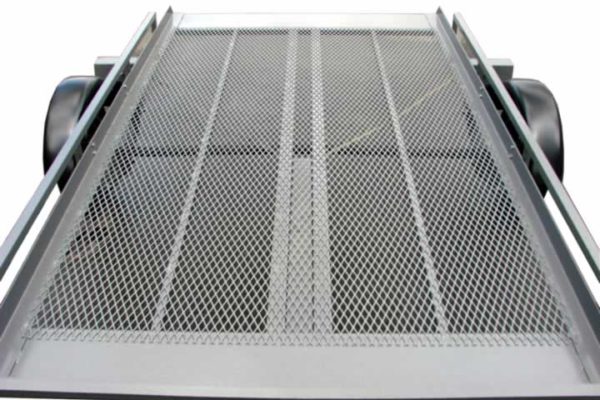 A metal ramp with a mesh surface on it.