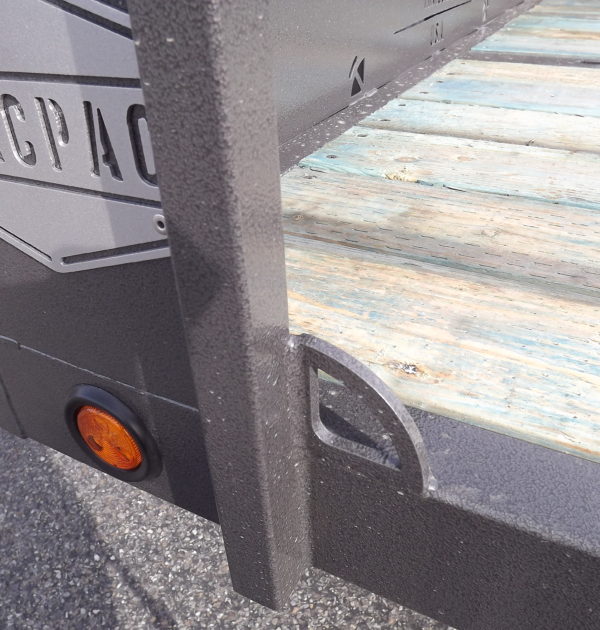 A close up of the side of a trailer.