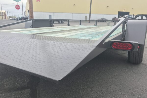 A trailer with ramps on the back of it.