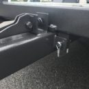 A close up of the lock on a trailer