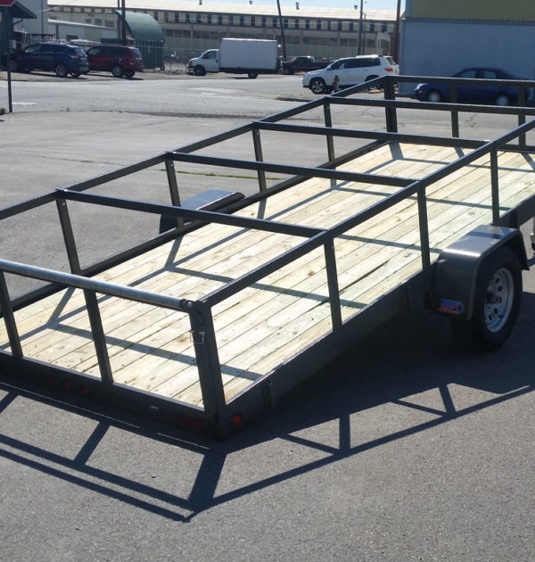 A trailer with a wooden frame on the back of it.