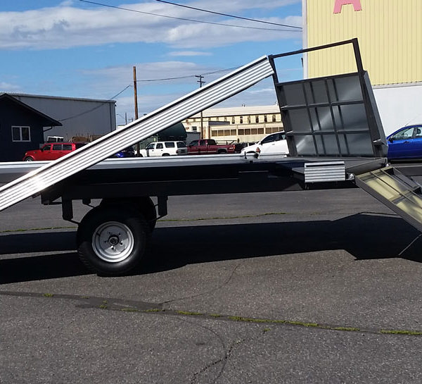 A truck with stairs on the back of it.