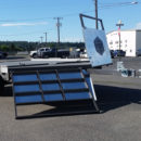 A truck with a large solar panel on the back of it.