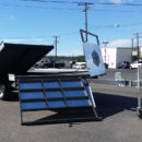 A truck with solar panels on the back of it.