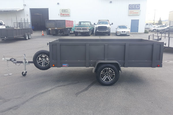 A trailer that has been painted black.
