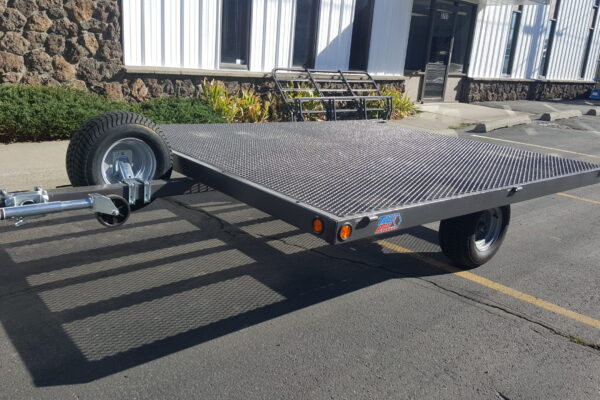 A trailer that is parked on the side of the road.