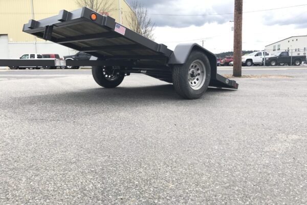 A trailer that is sitting in the street.