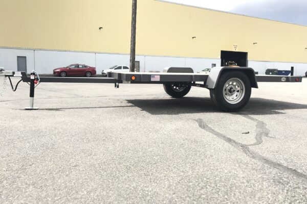 A trailer is parked in the parking lot.