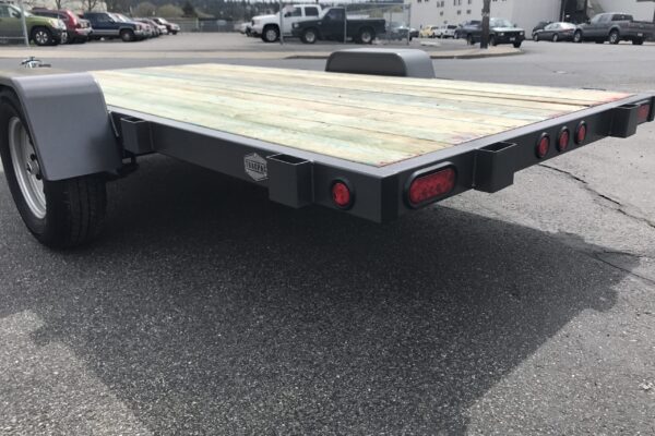 A car hauler trailer with the back end of it.