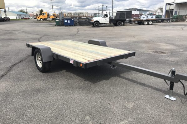 A trailer with a wooden board on it