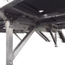 A close up of the underside of an aluminum structure.