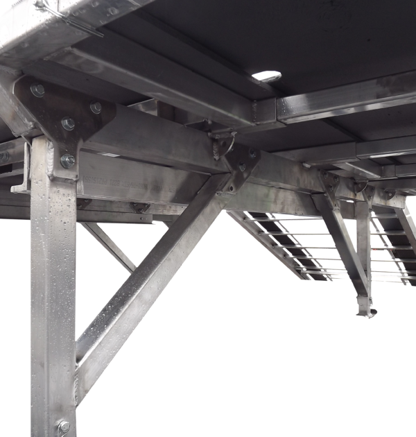 A close up of the underside of an aluminum structure.