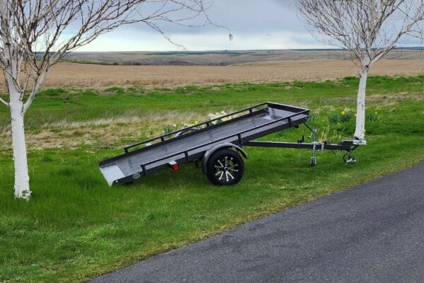 A trailer is parked on the side of the road.